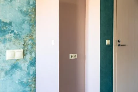 Geometric pattern of green and pink walls and door Stock Photos