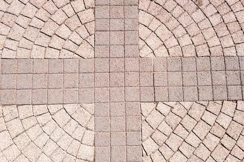 Geometric pattern of interlocking stone pavement Stock Photos