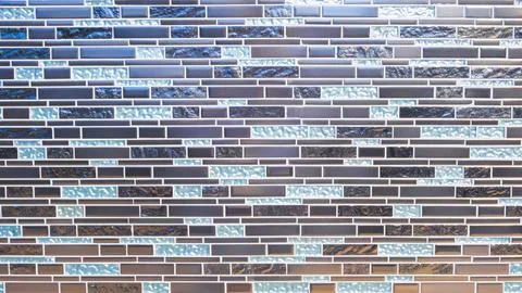 Geometric pattern of multicolored marble and mosaic tile wall decoration Stock Photos