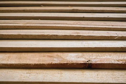 Geometric pattern of natural lumber construction material arrangement Stock Photos