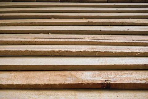 Geometric pattern of natural lumber construction material arrangement Stock Photos