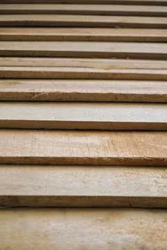 Geometric pattern of natural lumber construction material arrangement Stock Photos