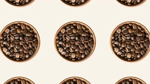Geometric pattern with roasted coffee beans in brown bowls on a beige background Stock Footage 147551752