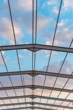The geometric pattern of a roof framework showing a worm's eye view of the sk Stock Photos