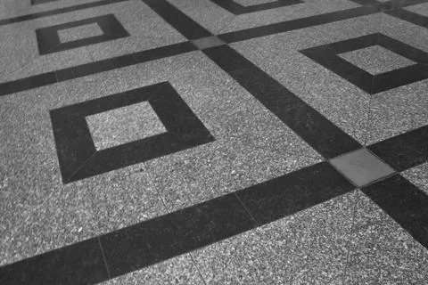 Geometric Pattern on a Textured Floor Surface Foto stock