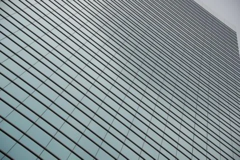 Geometric pattern of windows on glass skyscraper Stock Photos
