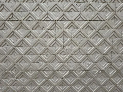 Geometric patterned light grey concrete tile wall texture Stock Photos