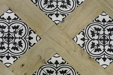 Geometric-Patterned Tile Flooring Combined With Light Wood In Trendy Design. Stock Photos