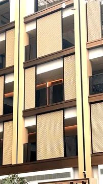 Geometric patterns and clean lines give the exterior a contemporary feel. The Stock Photos