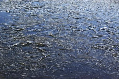 Geometric patterns in freezing ice Stock Photos
