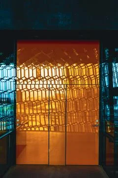 Geometric patterns reflected in sleek yellow doorway 写真素材