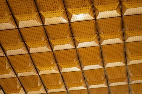 Geometric Patterns of a Yellow and Orange Ceiling with Intricate Design and.. 스톡 사진