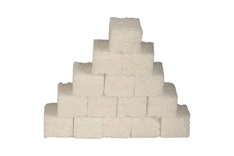 Geometric pyramid stack of crystalline refined white sugar cubes 库存照片