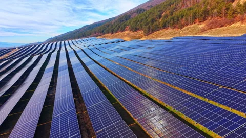 Geometric rows of solar panels on a hillside Stock Footage 333836799