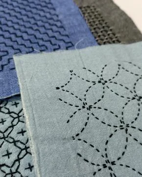 Geometric sashiko pattern with visible sewing thread. Foto stock