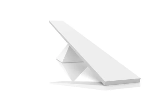 Geometric sculpture is balancing rectangular prism diagonally on wedge on Stock Photos