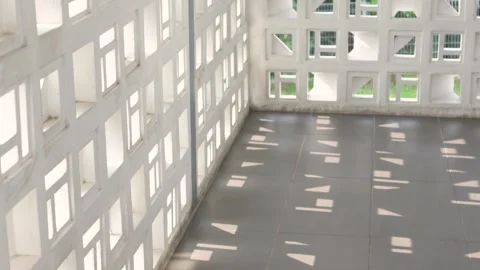 Geometric Shadows on Tiled Floor Through Concrete Ventilation Blocks Stock Footage 347038417