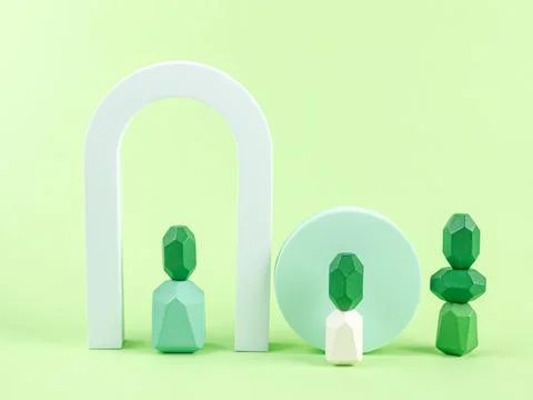Geometric shape wooden elements podium on green background. Design concept 库存照片