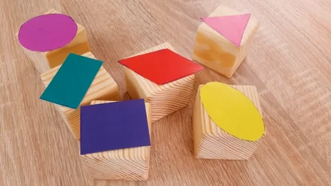 Geometric shapes cut out of colored paper, learning geometry, shapes Stock Footage 317326526