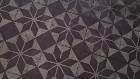 Geometric star pattern floor tiles captured in rhythmic motion video footage Stock Footage 337844190