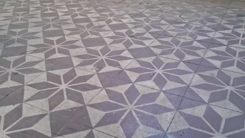 Geometric star pattern floor tiles captured in smooth motion video footage Stock Footage 337896974