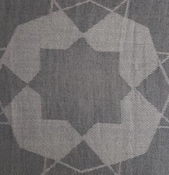 Geometric star pattern on grey woven fabric texture Stock Photos