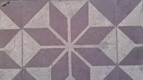 Geometric stone tile floor pattern captured in slow motion video clip Stock Footage 339248193
