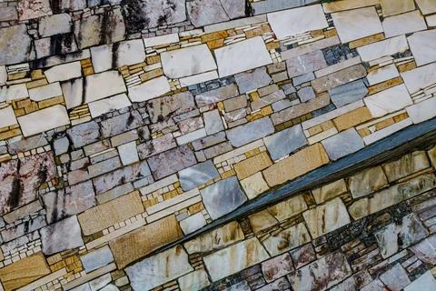 Geometric stone wall texture with rectangular marble and granite tiles in v.. Stock Photos