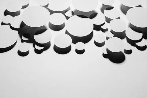 Geometric swarm motion mess pattern of white ovals in hard light with contras Stock Photos