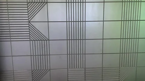 Geometric tile pattern on black wall Stock Footage 324751242