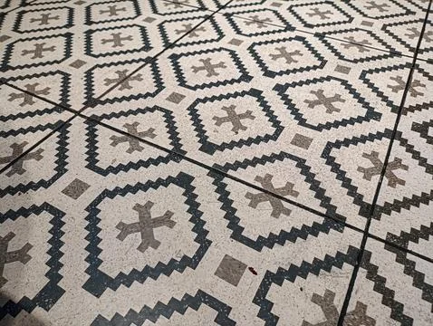 Geometric tiles form a vintage pattern. Dark lines contrast with lighter st.. 스톡 사진