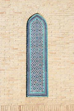 Geometric tilework panel on the brick wall of Islam Khoja Madrasah in Khiva.. Stock Photos