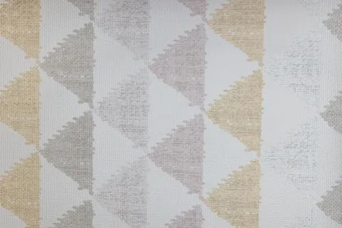 Geometric triangle pattern on light grey fabric background 库存照片