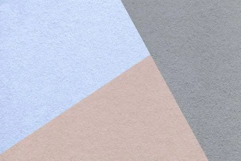 Geometric triangular light blue beige gray textured paper background with c.. Stock Photos