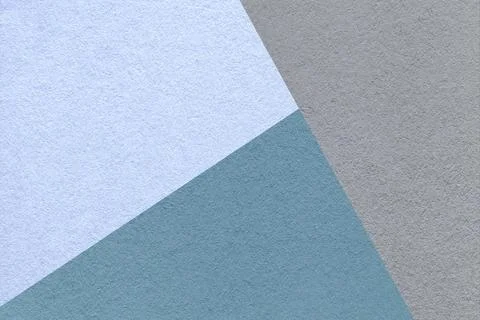 Geometric triangular light blue gray textured paper background with copy sp.. Illustrazione stock