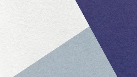 Geometric triangular white, light gray, dark blue textured paper background.. 스톡 사진