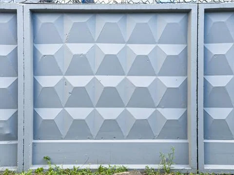 Geometric wall texture with triangular patterns, light gray color, modern i.. Stock Photos