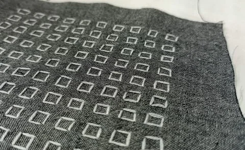 Geometric White Embroidery Pattern on Dark Fabric – Textile Texture Close Up Stock Photos
