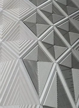  geometric white patterns and cladding on wall of a modern building geomet... 库存照片