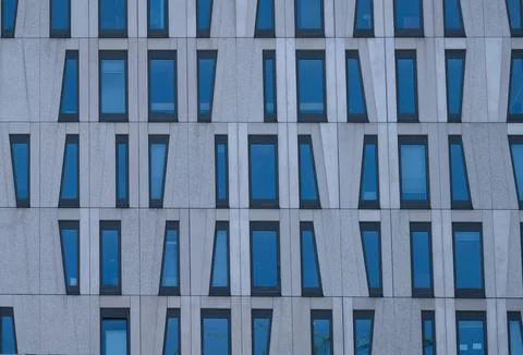 Geometric Window Pattern on Modern Building Facade Stock Photos