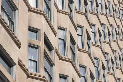 Geometric Window Pattern on Modern Urban Building Stock Photos