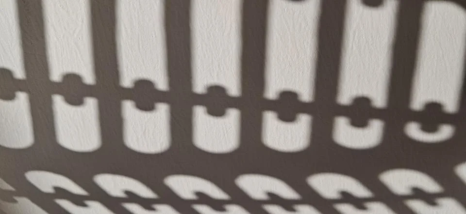 Geometric Window Shadow Formation on Light Wall Stock Photos