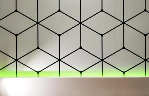Geometrical pattern with black line cubes on a white wall Fotos de archivo