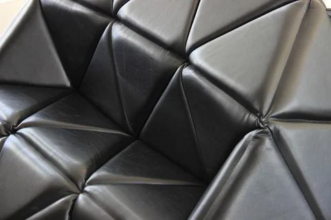 Geometrical shape with triangles on a black surface Foto stock