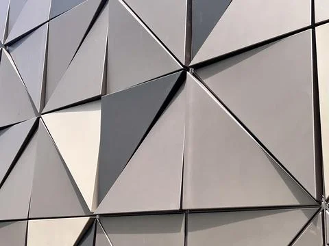 Geometrical triangulars shape on metal building wall 库存照片