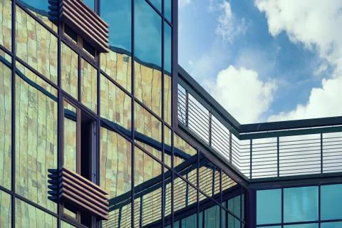 The geometry of the facade of the building with reflection Stock Photos