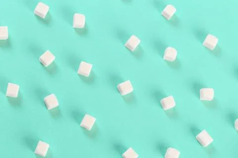 Geometry Pattern made of white sugar cubes on light blue background. Abstract Stock Photos