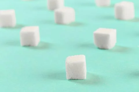 Geometry Pattern made of white sugar cubes on light blue background. Abstract Foto stock