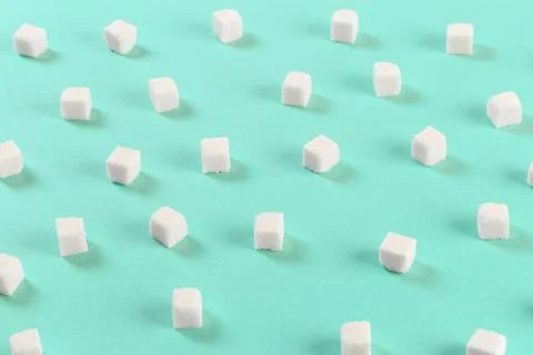 Geometry Pattern made of white sugar cubes on light blue background. Abstract Stock Photos