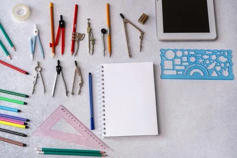 Geometry tools, pencils, and empty notebook on a desk. Drafting and enginee.. Stock Photos